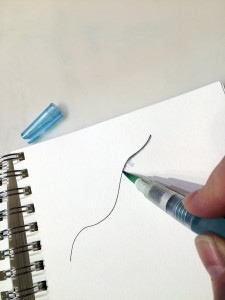 Running a wet brush along one side of the line will drag out some of the color, creating a shadow effect.